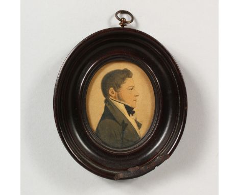 AN OVAL PORTRAIT MINIATURE OF A GENTLEMAN, in an ebony frame. 4.5ins x 4ins.