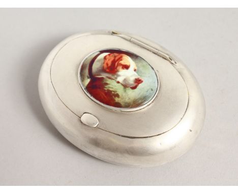 A GOOD OVAL SNUFF-TOBACCO BOX, the lid with an enamel of a dog. 3.5ins long.  Birmingham 1942.  Mappin &amp; Webb.