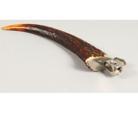 A HERMES OF PARIS ANTLER HORN CIGAR CUTTER. 11ins long.