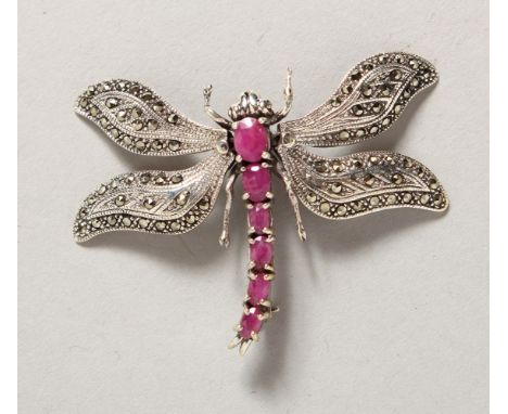 A SILVER AND RUBY MARCASITE DRAGONFLY BROOCH.