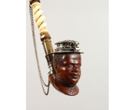 A VERY GOOD CARVED WOOD, HORN AND IVORY PIPE, with silver mount, the bowl carved as a male bust. 10ins long.