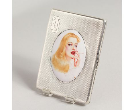 A GOOD ENGINE TURNED SILVER CIGARETTE CASE, the lid with an enamel, smoking a cigarette.