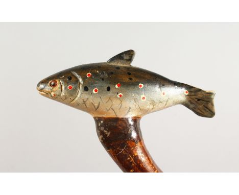 A WALKING STICK, the handle carved as a trout. 51ins long.