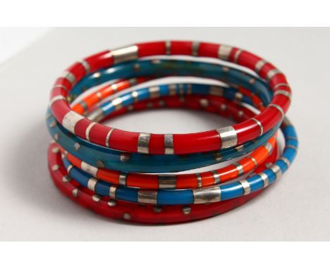 FIVE SILVER AND ENAMEL BANGLES.