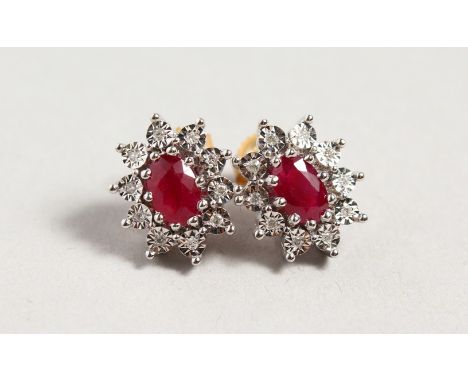 A PAIR OF 9CT GOLD, RUBY AND DIAMOND CLUSTER EARRINGS.