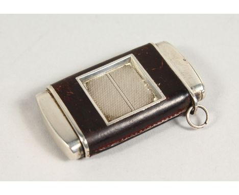 A HERMES OTOMATO LEATHER BOUND TRAVELLING WATCH. 6cms long.