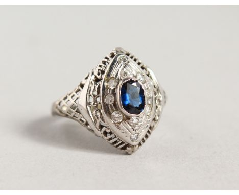 A SAPPHIRE AND DIAMOND RING, possibly in a white gold mount, unmarked.