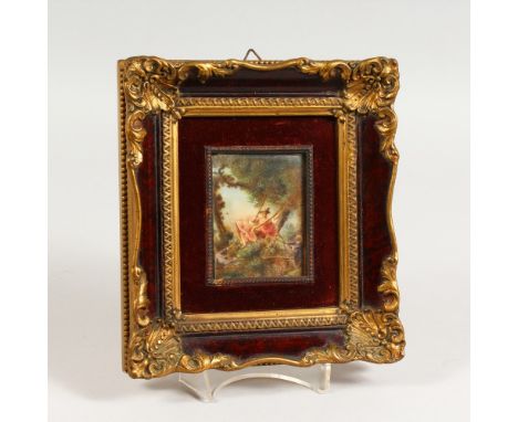 A 20TH CENTURY PORTRAIT MINIATURE, young girl on a swing, in a decorative frame. 8ins x 7.25ins.