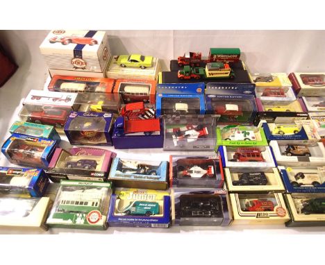 Selection of approximately forty boxed diecast vehicles; cars, buses, vans, racing cars etc. Various makes, mostly in very go