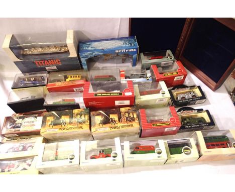 Twenty five assorted diecast vehicles, all boxed; fire engines, ship, aircraft etc. Mostly in excellent condition and empty w