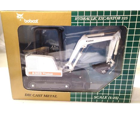 Bobcat hydraulic excavator 325 by Melrose Clark Company, moveable bucket, blade, boom etc rotating, excellent condition, boxe