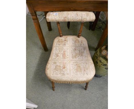 Victorian upholstered stick back low chair on turned supports 