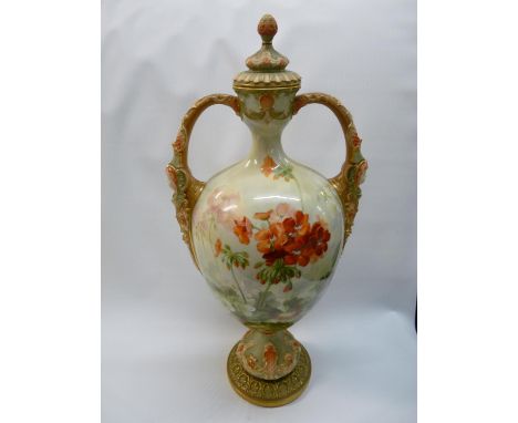 Large Royal Worcester two handled Geranium decorated vase by Frank Roberts with gilded mask handles, surmounted by finial top