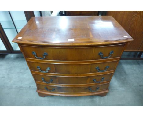 A yew wood bow front chest of drawers 