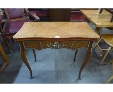 A French Louis XV style mahogany, walnut and gilt metal mounted serpentine card table, 77cms h, 84cms w, 42cms d 