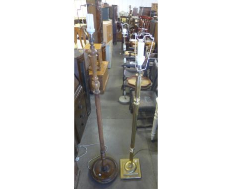 A brass standard lamp and a beech standard lamp 