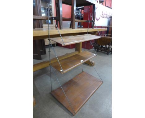 A teak and metal wall hanging three tier shelf 