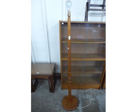A teak standard lamp 