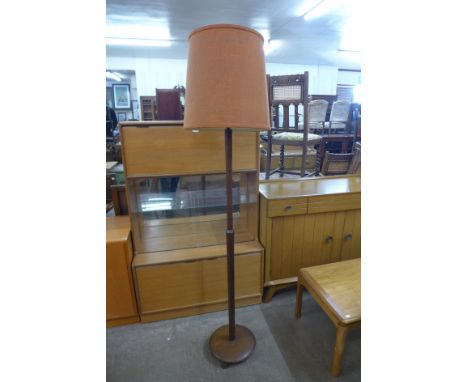 A teak standard lamp 