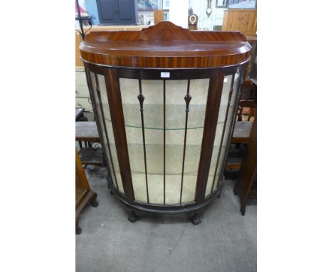 A mahogany bow front display cabinets 