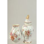 A FAMILLE ROSE ARMORIAL PORCELAIN LIDDED JAR, together with a famille rose porcelain floral jug, (