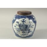 AN EARLY 20TH CENTURY CHINESE BLUE AND WHITE PORCELAIN JAR AND HARDWOOD COVER, decorated with panels