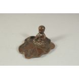 A BRONZE OKIMONO OF A LOTUS CHILD, base 8cm x 6.5cm.
