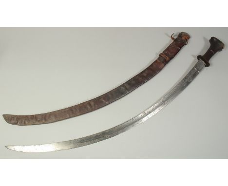 A FINE 18TH-19TH CENTURY ETHIOPIAN RHINO HORN HILTED SWORD, blade with etched portrait of a ruler as well as calligraphy, han