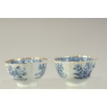 A PAIR OF CHINESE BLUE AND WHITE PORCELAIN TEA BOWLS, with gilded rims and decorated with precious