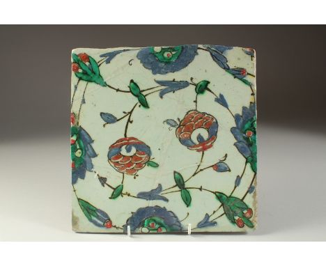 A FINE 17TH CENTURY OTTOMAN TURKISH IZNIK TILE, 25cm x 25cm.