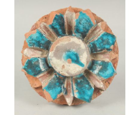 A FINE 17TH-18TH CENTURY MUGHAL INDIAN FLOWER SHAPED TILE, 16cm diameter.