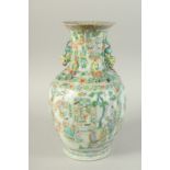 A CHINESE FAMILLE VERTE PORCELAIN VASE, painted with panels of figures, the neck with moulded