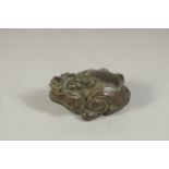 A BRONZE OKIMONO OF A TEMPLE DOG, 4.5cm long.
