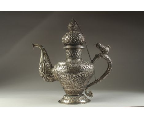 A LARGE CHINESE EMBOSSED AND ENGRAVED WHITE METAL LIDDED JUG, possibly low grade silver, decorated all over with various moti