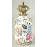 A CHINESE FAMILLE ROSE PORCELAIN LAMP, painted with figures, precious objects, butterflies,
