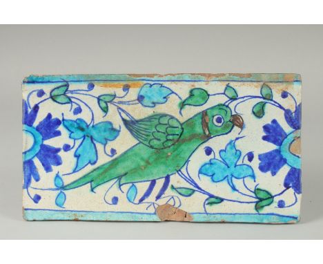 A FINE 18-19TH CENTURY MUGHAL NORTH INDIAN MULTAN TILE WITH PARROT DESIGN, 29cm x 15.5cm.