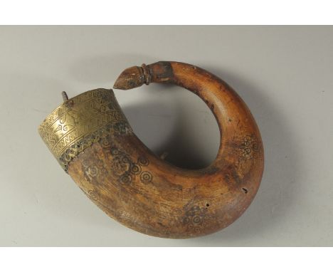 AN 18TH CENTURY MUGHAL INDIAN BRASS MOUNTED CARVED HORN POWDER FLASK, 17cm high.