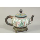 A CHINESE FINELY ENAMELLED TEAPOT ON BRONZE STAND, intricately painted with panels of flora and