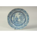 A 19TH CENTURY CHINESE BLUE AND WHITE PORCELAIN PLATE, painted with a floral vase and censer on a