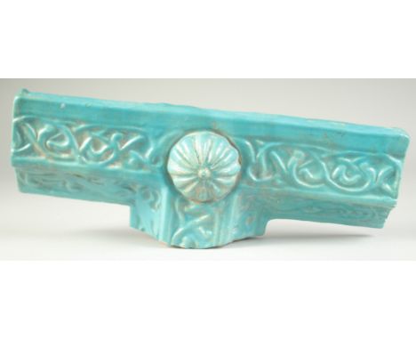 A FINE AND LARGE 12TH-13TH CENTURY PERSIAN KASHAN TURQUOISE GLAZED BORDER TILE, with animals and Arabesque decoration, 41cm l