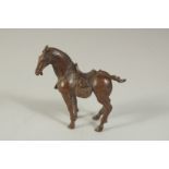 A BRONZE OKIMONO OF A HORSE, 7.5cm long.
