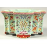 A CHINESE TURQUOISE GROUND FAMILLE ROSE PORCELAIN PLANTER, with fine floral decoration and bats,