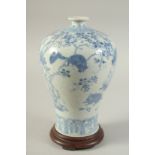A CHINESE BLUE AND WHITE PORCELAIN MEIPING VASE ON HARDWOOD STAND, decorated with squirrels and