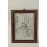 AN EARLY 20TH CENTURY CHINESE FAMILLE ROSE PORCELAIN PLAQUE depicting musicians, inset within a