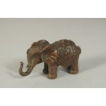 A BRONZE FIGURE OF AN ELEPHANT, 6cm long.