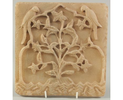 A FINE 18TH CENTURY MUGHAL INDIAN CARVED ALABASTER OR MARBLE TILE, depicting a flowering tree with two parrots, the base with
