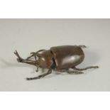 A BRONZE OKIMONO OF A STAG BEETLE, with hinged lid, 9cm long.