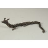 AN ARTICULATED BRONZE OKIMONO OF A DRAGON, 38cm long outstretched.