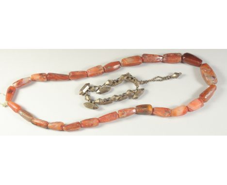 A POSSIBLY ANCIENT AGATE BEADED NECKLACE, along with a Mughal Indian gilt metal bracelet, with possibly small amulet cases, (