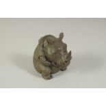 A BRONZE OKIMONO OF A RHINOCEROS, 6.5cm high.